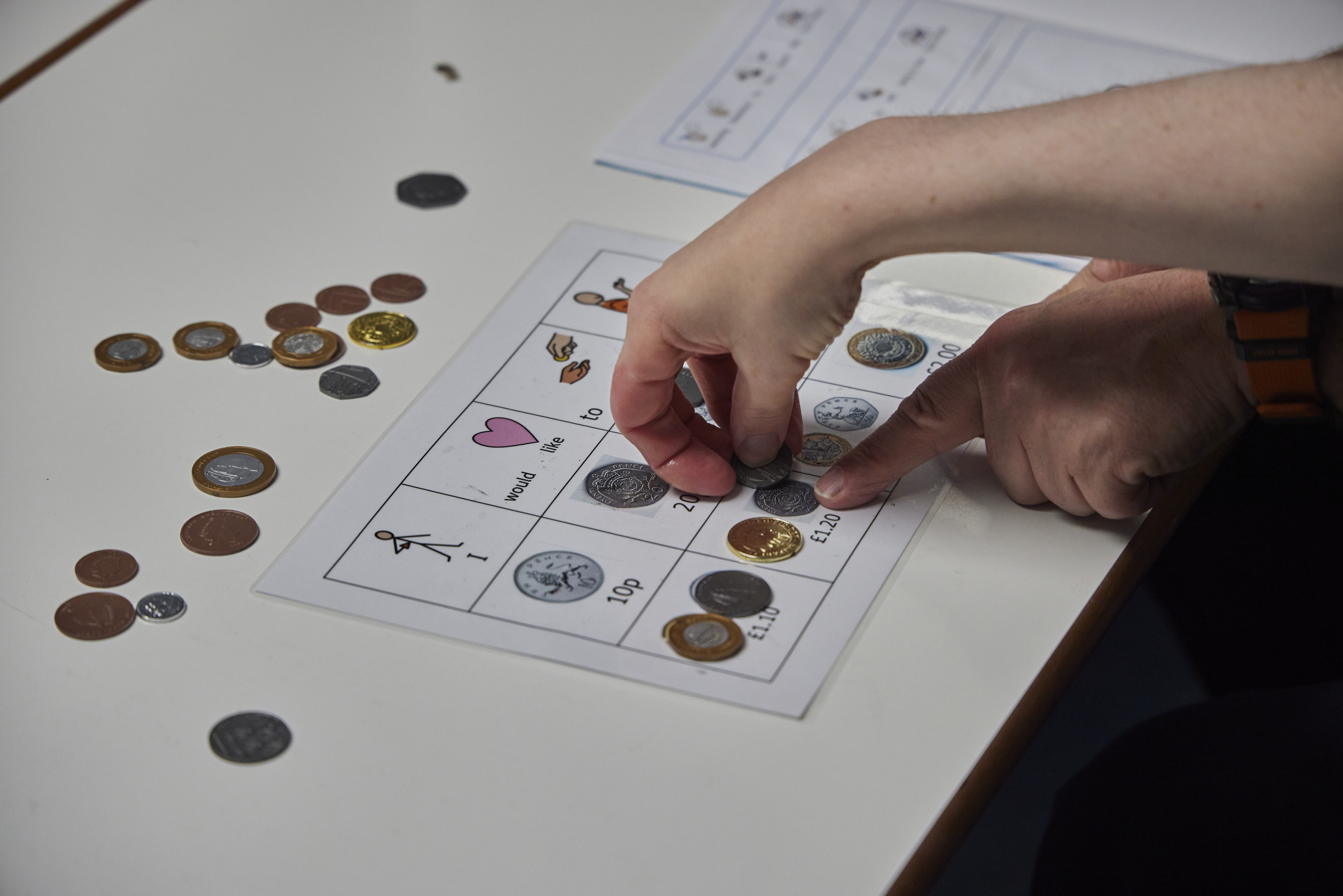 Children playing a coin match game