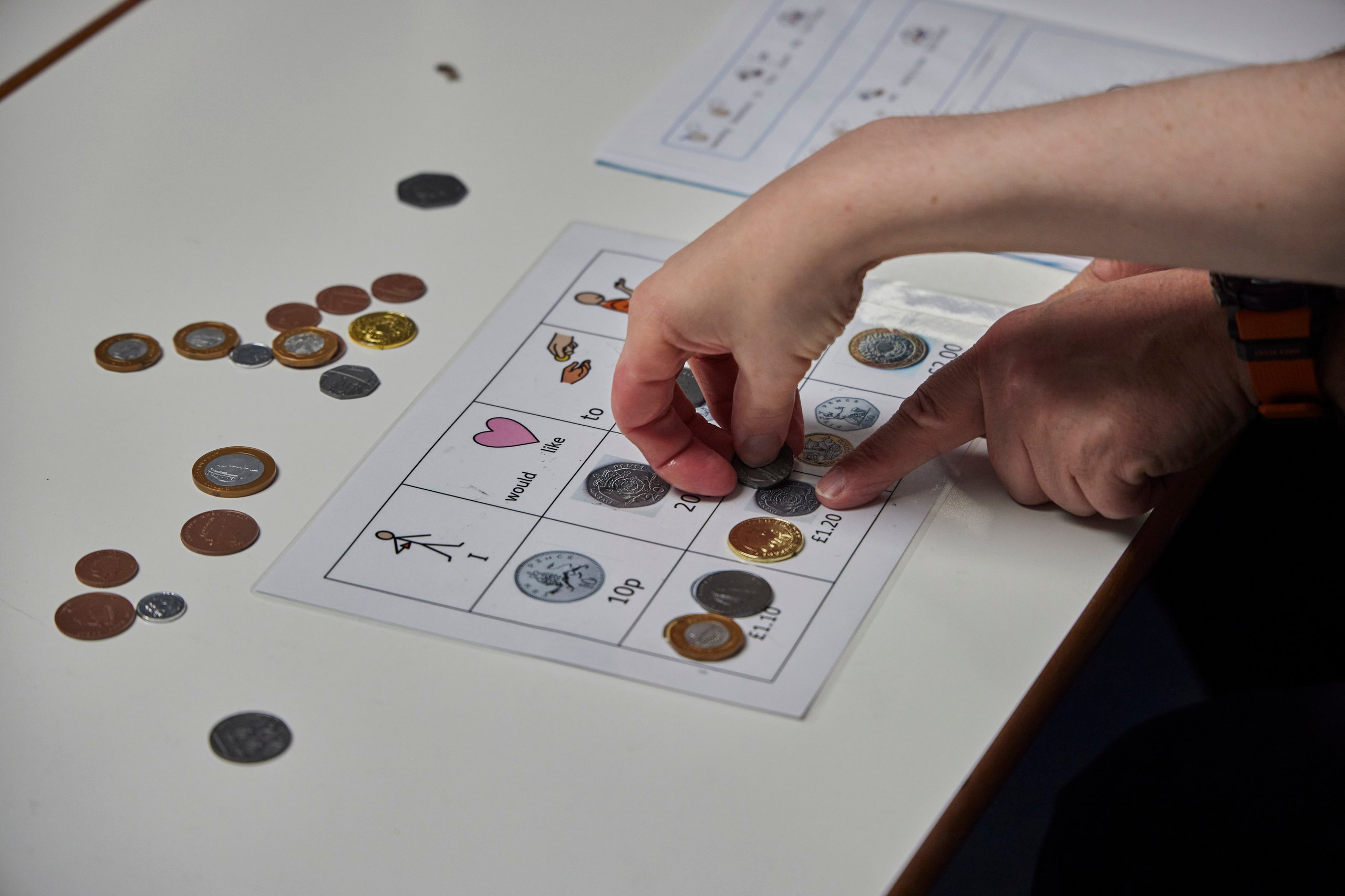 Children playing a coin match game